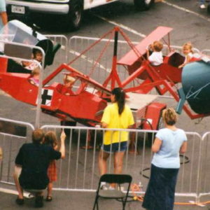 Photo of a kiddie amusement ride with bi plane and helicopter aircraft