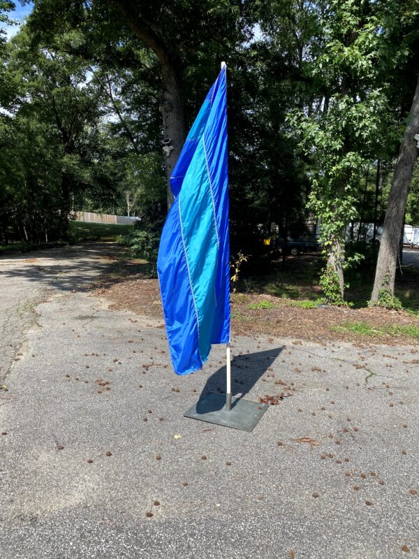 Blue Vertical Flag 3x8 on white flag pole