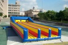 Inflatable Game that contestants run with a bungee cord attached to them
