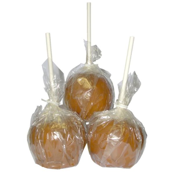Photo of three caramel apples in wrappers