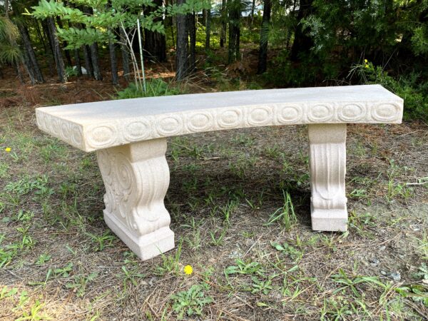 a faux sandstone garden bench