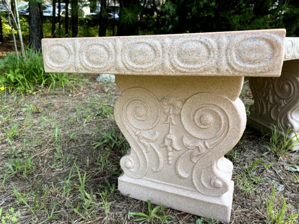 Close up of a faux sandstone garden bench
