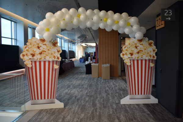 Giant Popcorn Box Prop with a Balloon Arch