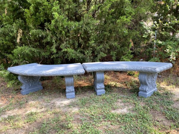 A pair of Faux Granite or Concrete looking curved benches
