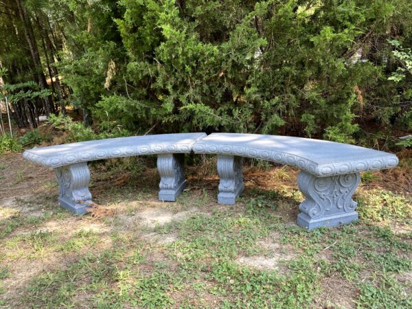 A pair of Faux Granite or Concrete looking curved benches