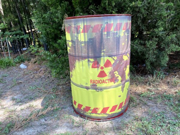 Large Metal Drum Prop for Halloween that says radioactive waste