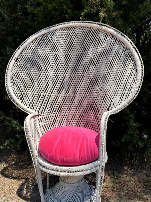 White Wicker Chair with a Fan back and a pink cushion