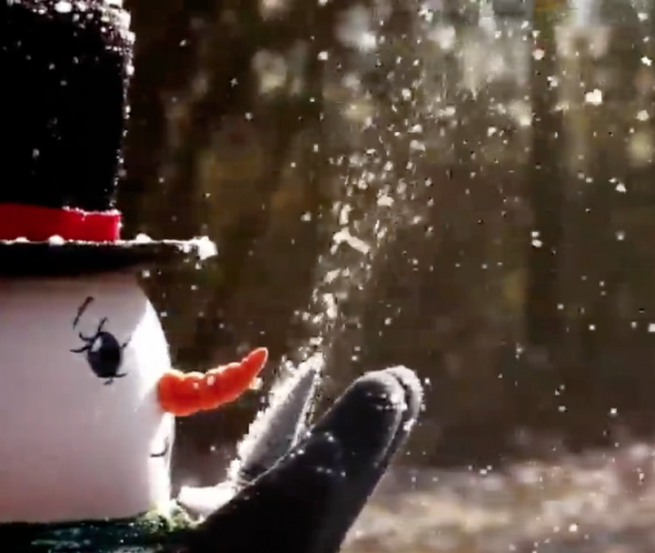 Snowman blowing snow special effects machine