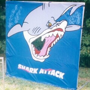 Carnival Game featuring a big shark that players throw plastic fish at to win a prize