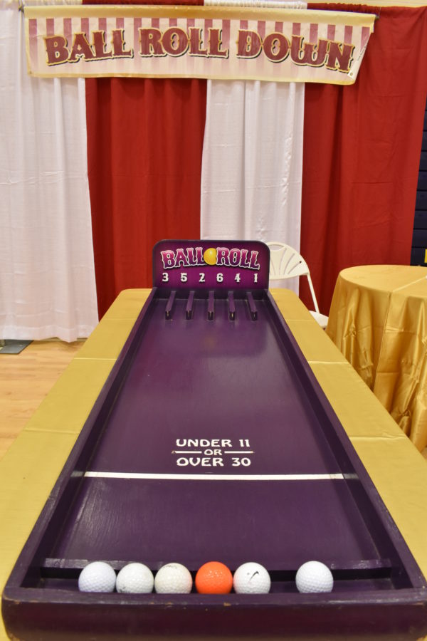 Purple Carnival Game Called Ball Roll - uses golf balls to score a prize