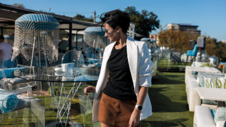 sexy-brunette-woman-white-jacket-black-shirt-leather-brown-skirt-restaurant